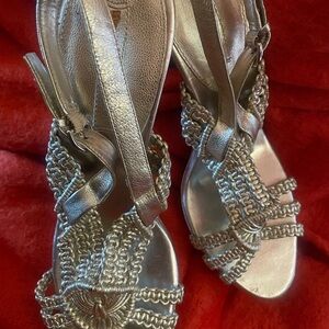 Never worn, beautiful gold heels! A nice addition to your shoes collection!